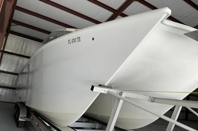 Slide: The Image of 2022 Freeman 34VH boat on trailer in storage facility. - 67