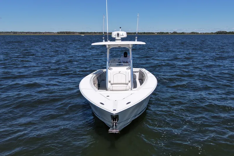 Slide: The Image of 2014 Jupiter 30 FS boat on open water under clear blue sky. - 1