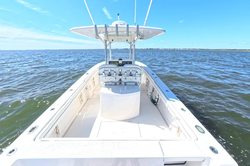 Slide: The Image of 2014 Jupiter 30 FS boat on open water under clear blue sky. - 14