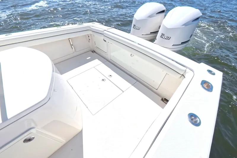 Slide: The Image of 2014 Jupiter 30 FS boat with dual engines on open water. - 18