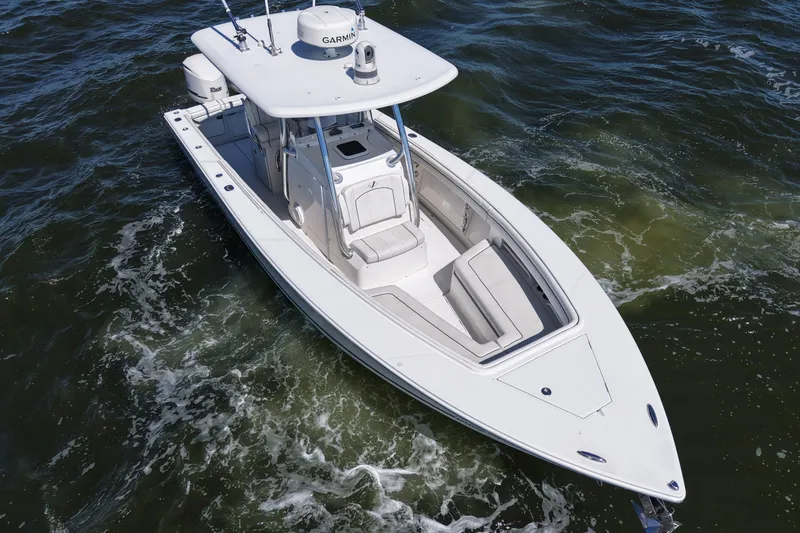 Slide: The Image of 2014 Jupiter 30 FS boat on water, aerial view, white hull, equipped with Garmin. - 8