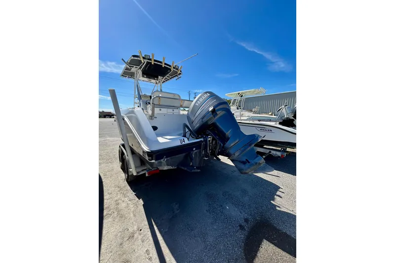 Slide: The Image of 2006 Century 2200 Center Console boat with Yamaha outboard motor on trailer. - 10