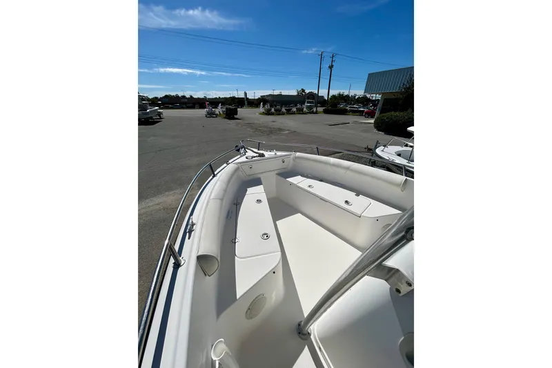 Slide: The Image of 2006 Century 2200 Center Console boat, docked, under clear blue sky. - 5