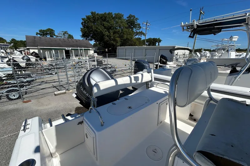 Slide: The Image of 2006 Century 2200 Center Console boat with Yamaha outboard motor in a marina. - 8