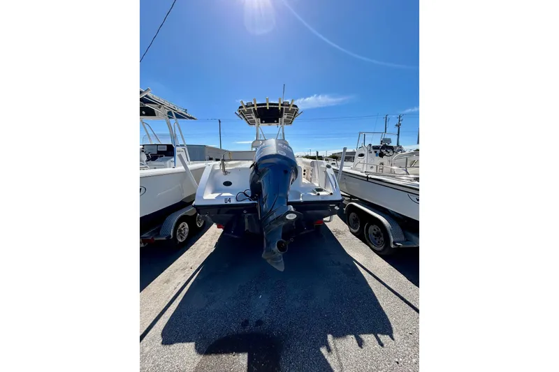 Slide: The Image of 2006 Century 2200 Center Console boat on trailer under clear blue sky. - 9