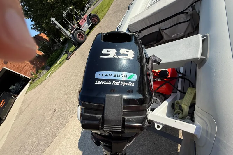 Slide: The Image of Outboard motor on a 2020 Highfield Classic 310 boat, featuring lean burn technology. - 9