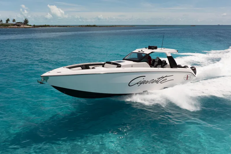 Slide: The Image of 2025 Cigarette 42 Auroris speedboat cruising on clear blue ocean waters. - 3