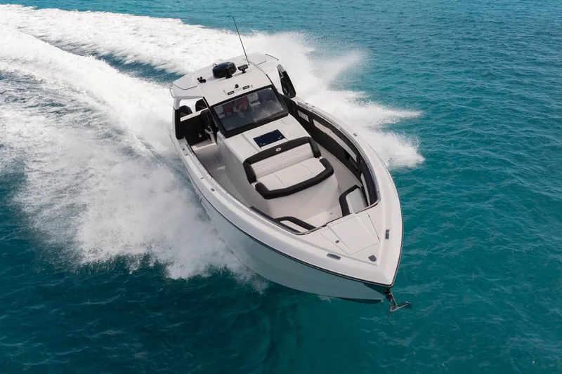 Slide: The Image of 2025 Cigarette 42 Auroris speedboat cruising on clear blue water. - 4