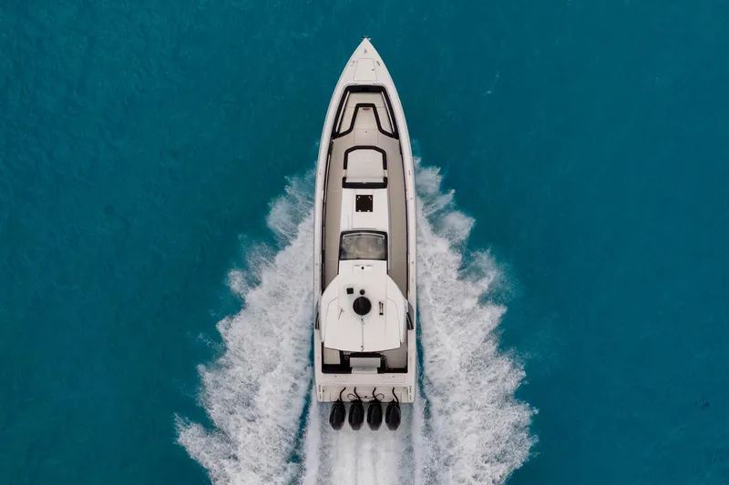 Slide: The Image of Aerial view of 2025 Cigarette 42 Auroris speedboat cruising on clear blue water. - 5