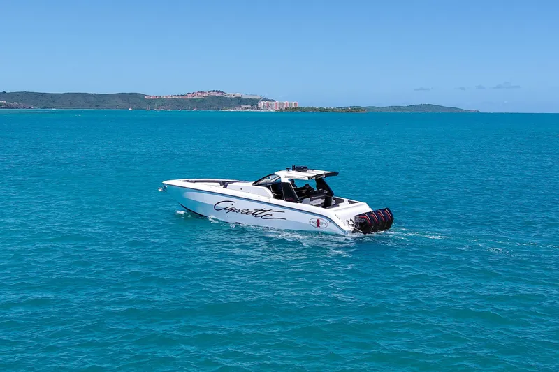 Slide: The Image of 2025 Cigarette 42 Auroris boat cruising on clear blue ocean waters. - 9