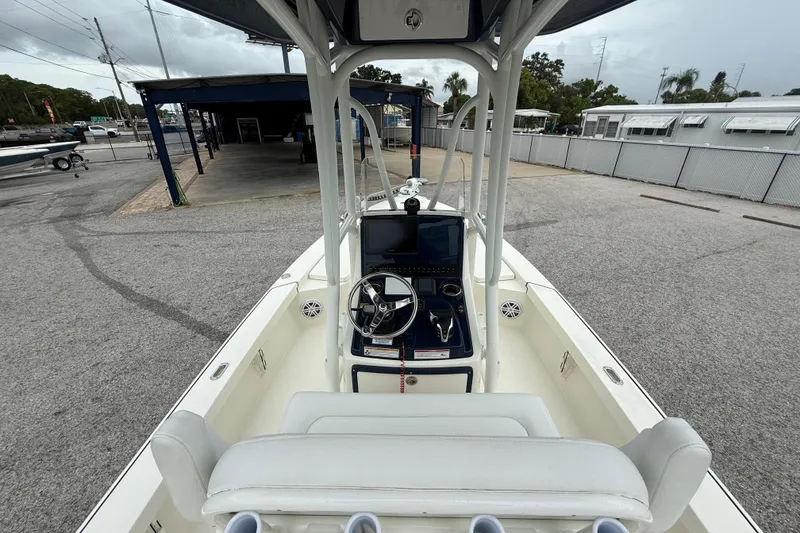Slide: The Image of 2026 Pathfinder 2300 HPS boat interior with steering console and seating. - 14