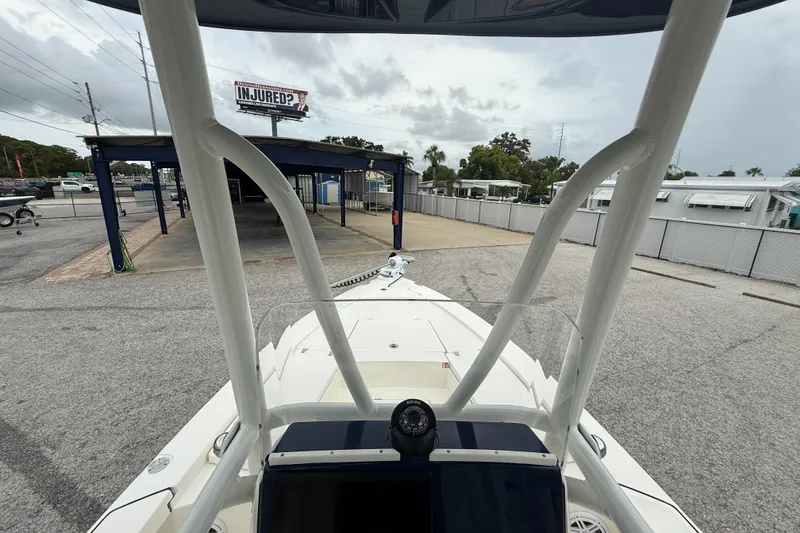 Slide: The Image of 2026 Pathfinder 2300 HPS boat parked in a lot, view from the bow. - 16