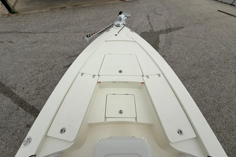 Slide: The Image of 2026 Pathfinder 2300 HPS boat deck with storage compartments, viewed from above. - 17