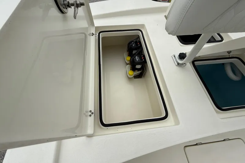 Slide: The Image of Open storage compartment on 2026 Pathfinder 2300 HPS boat, showing interior details. - 26