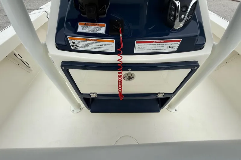 Slide: The Image of 2026 Pathfinder 2300 HPS boat console with safety warnings and controls. - 28
