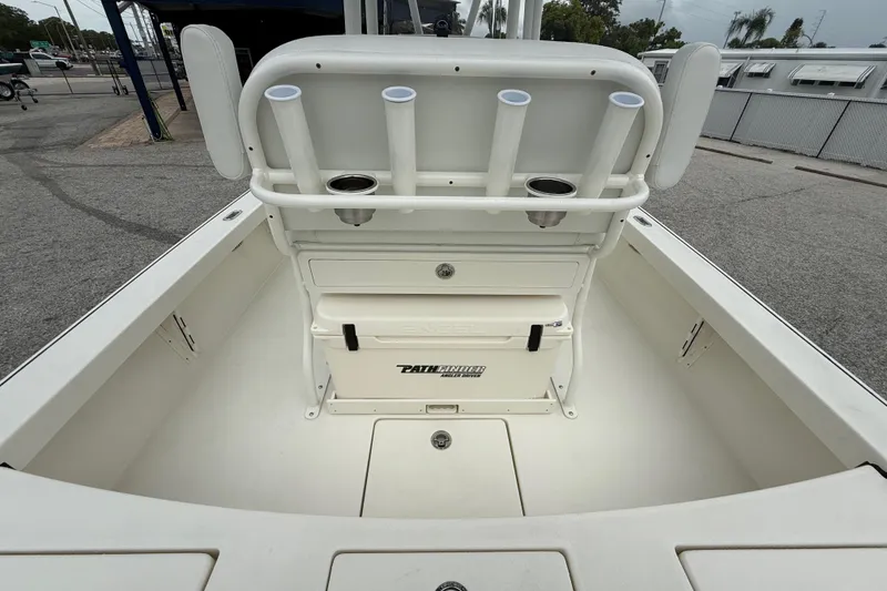 Slide: The Image of 2026 Pathfinder 2300 HPS boat interior with rod holders and storage compartments. - 30
