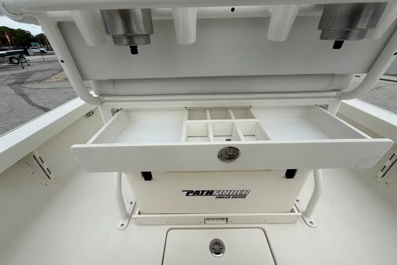 Slide: The Image of 2026 Pathfinder 2300 HPS boat with open storage compartment and organized tackle drawer. - 31
