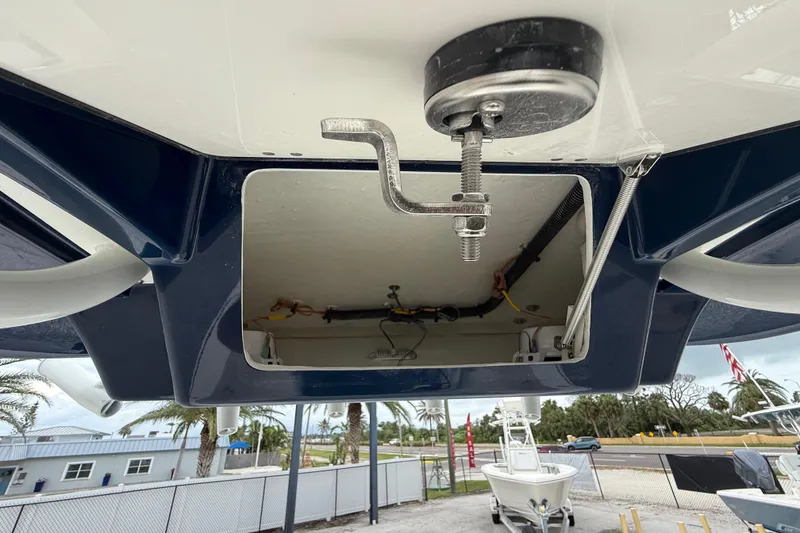 Slide: The Image of 2026 Pathfinder 2300 HPS boat underside view with visible wiring and components. - 34