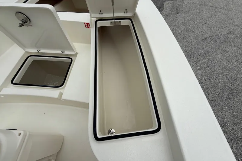 Slide: The Image of Open storage compartments on a 2026 Pathfinder 2300 HPS boat, showcasing ample space. - 37