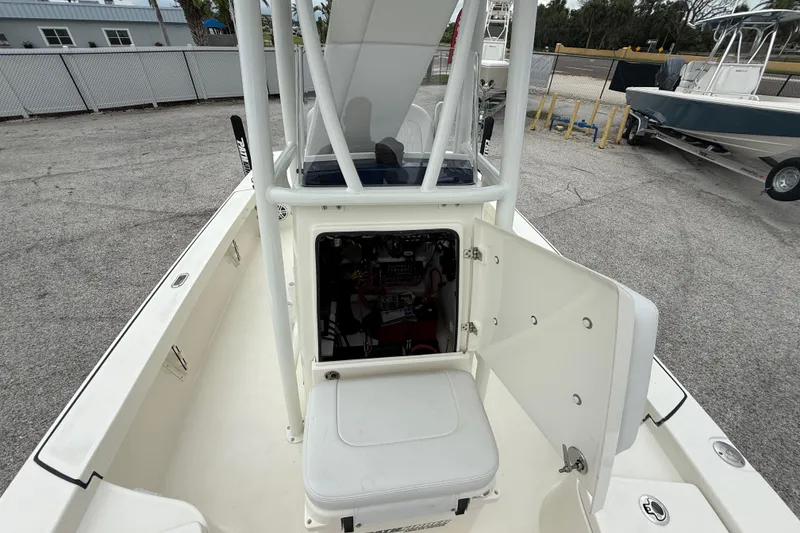 Slide: The Image of 2026 Pathfinder 2300 HPS boat interior with open storage compartment and seating. - 42