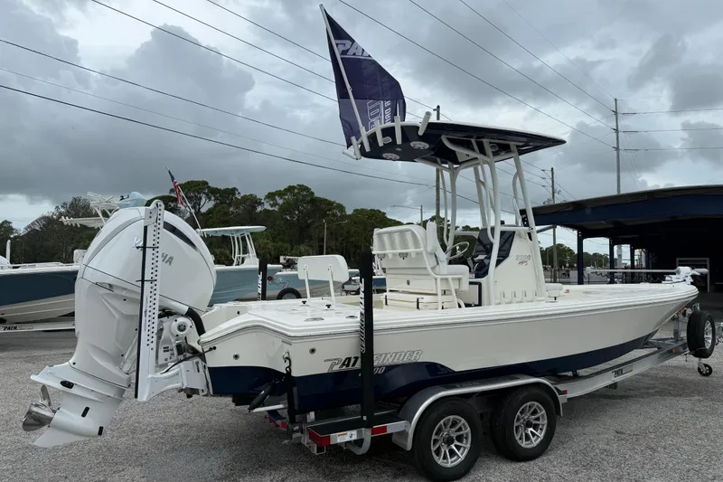 Slide: The Image of 2026 Pathfinder 2300 HPS boat on trailer, featuring Yamaha outboard motor, under cloudy sky. - 7