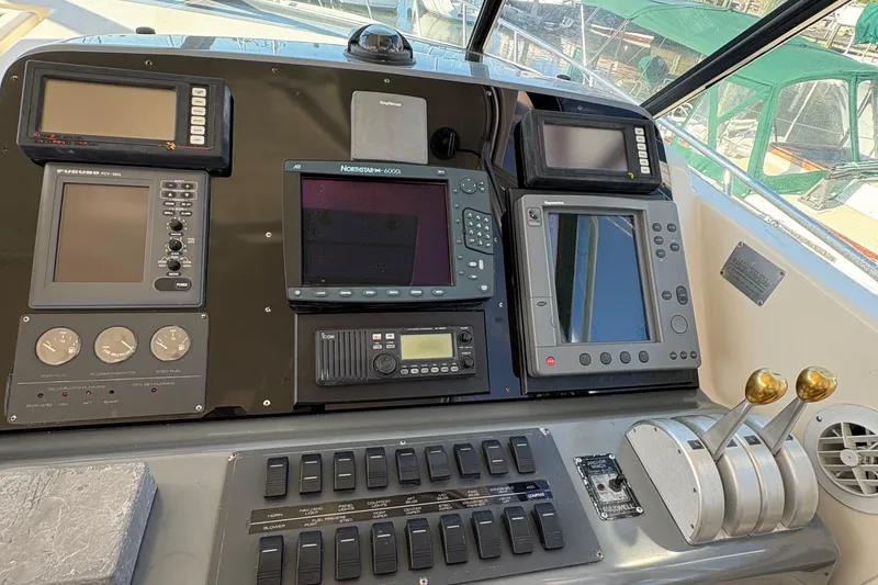 Slide: The Image of Control panel of a 1996 Tiara 4300 Open boat with navigation equipment. - 12