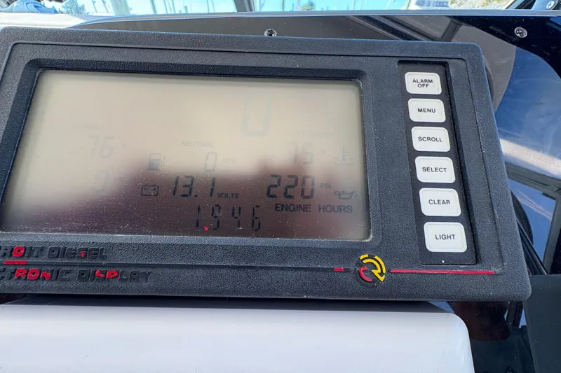 Slide: The Image of Dashboard display of a 1996 Tiara 4300 Open boat showing engine metrics. - 16