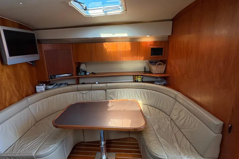 Slide: The Image of Interior of 1996 Tiara 4300 Open yacht with leather seating and wooden finishes. - 24