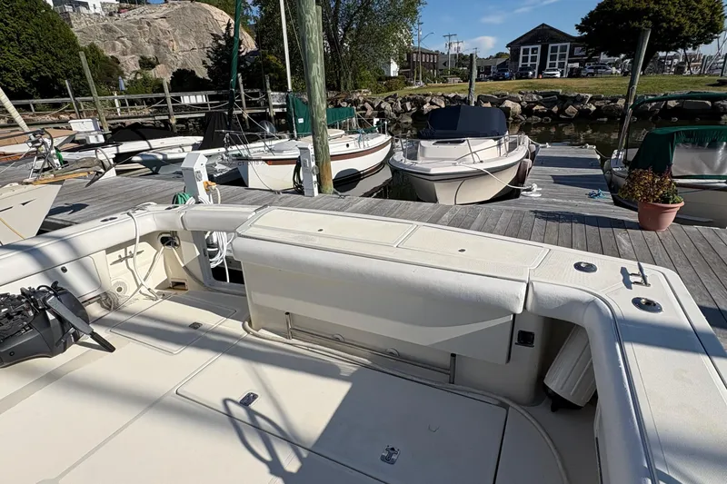 Slide: The Image of 1996 Tiara 4300 Open yacht docked at a marina, surrounded by other boats. - 30