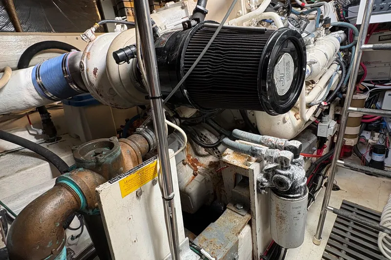 Slide: The Image of Engine room of a 1996 Tiara 4300 Open boat, showcasing mechanical components. - 33