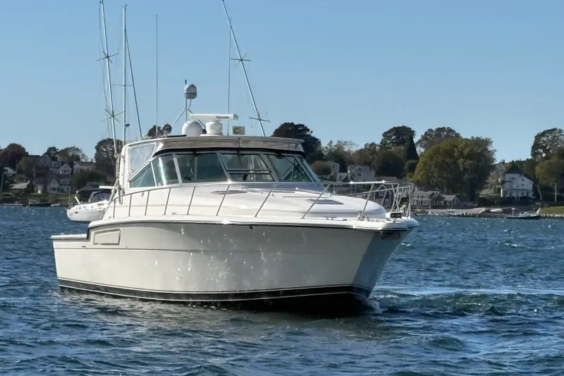 Slide: The Image of 1996 Tiara Yachts 4300 Open cruising on a scenic waterway. - 10