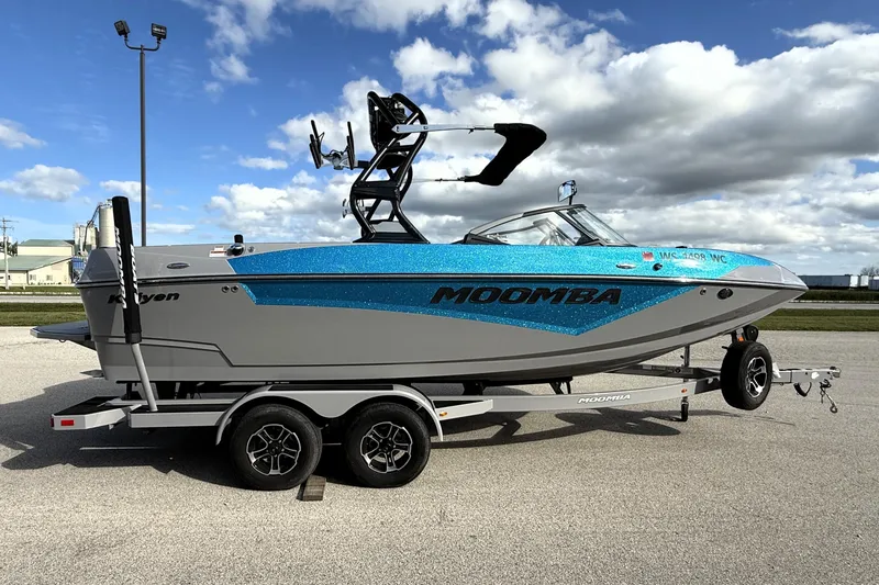 The Image of 2022 Moomba Kaiyen boat on trailer under cloudy sky. - 0