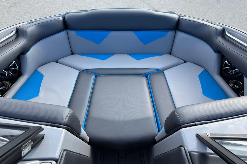 Slide: The Image of 2022 Moomba Kaiyen boat interior with blue and gray seating, showcasing modern design. - 15