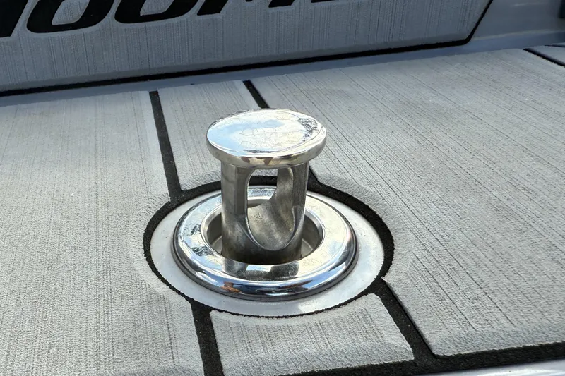 Slide: The Image of 2022 Moomba Kaiyen boat cleat on textured deck surface. - 24