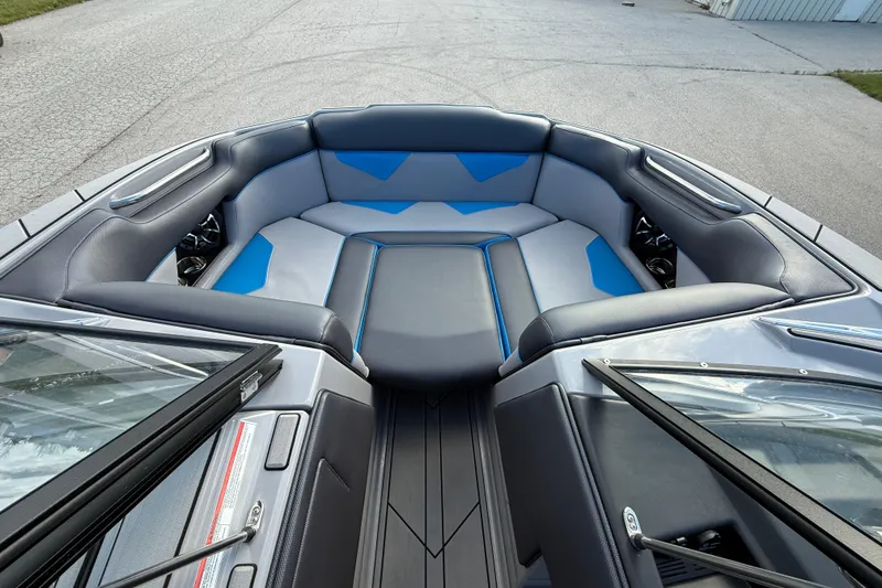 Slide: The Image of 2022 Moomba Kaiyen boat interior with blue and gray seating, showcasing modern design. - 3