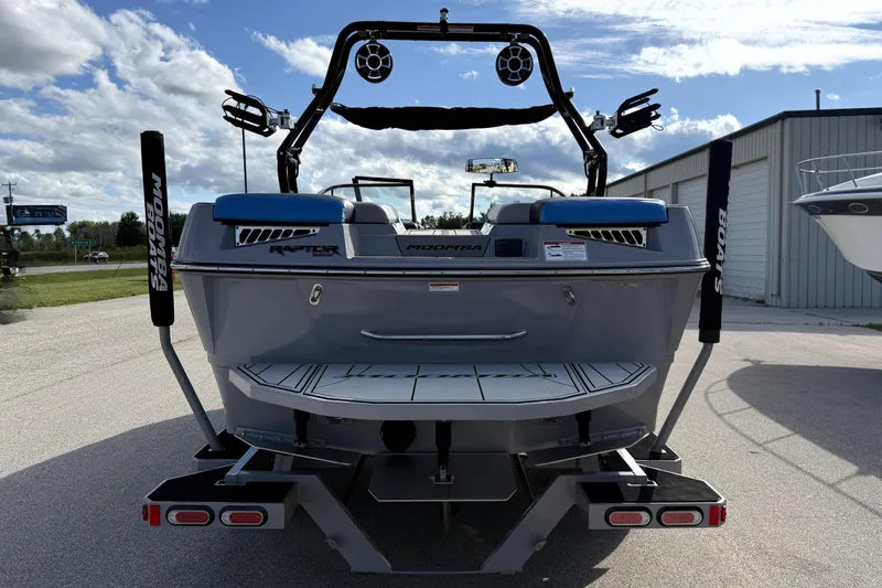 Slide: The Image of 2022 Moomba Kaiyen boat rear view with wakeboard tower and speakers. - 4
