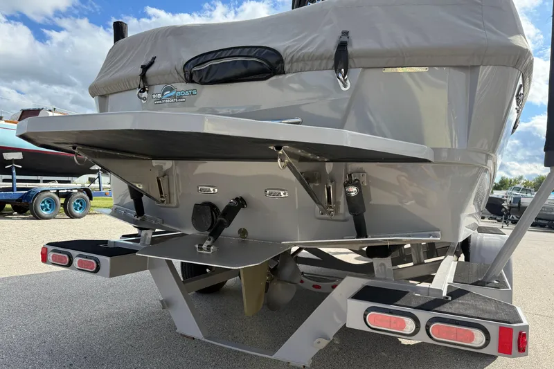 Slide: The Image of 2022 Moomba Kaiyen boat rear view with trailer, showcasing hull and propeller. - 7