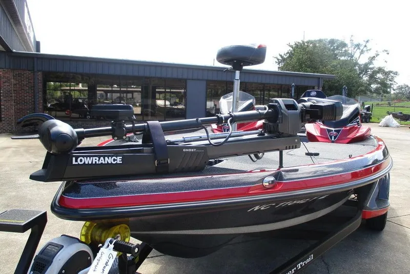 Slide: The Image of 2022 Ranger Z520R boat with Lowrance equipment, parked outdoors. - 3