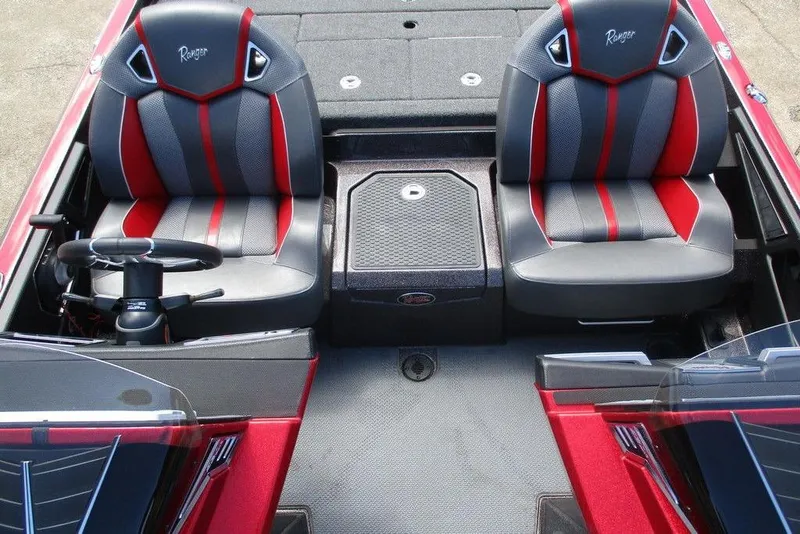 Slide: The Image of 2022 Ranger Z520R boat interior with red and gray seats, steering wheel, and console. - 6
