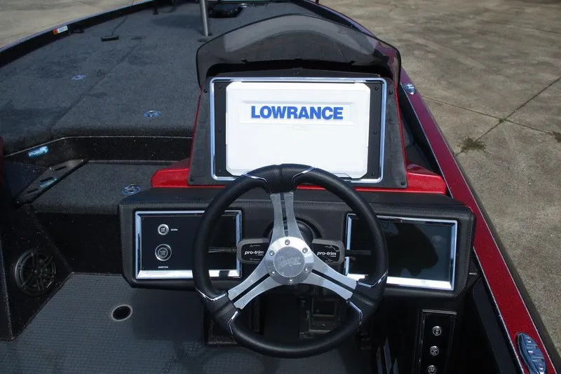 Slide: The Image of 2022 Ranger Z520R boat dashboard with Lowrance display and steering wheel. - 8