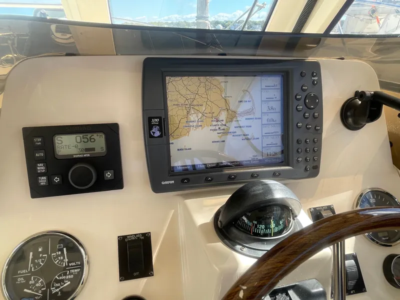 Slide: The Image of 2005 Mainship Pilot 30-II helm with navigation equipment and steering wheel. - 13