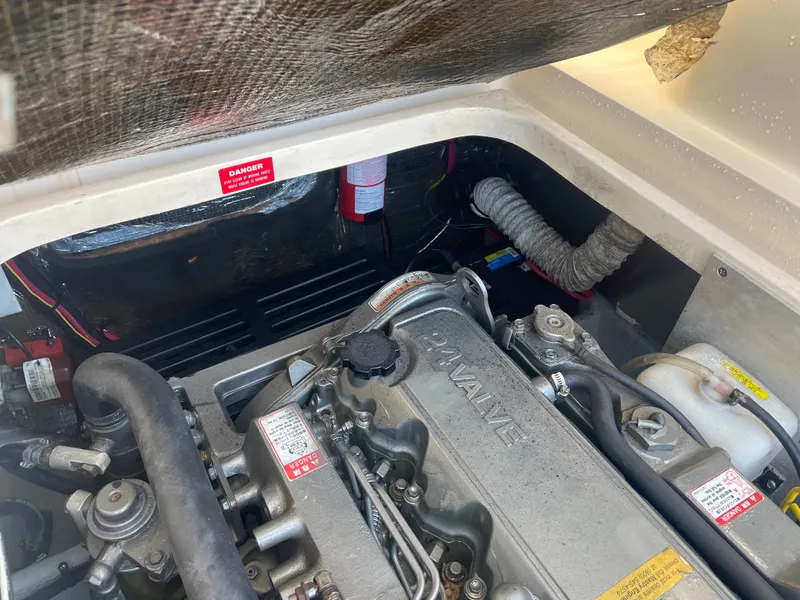 Slide: The Image of Engine compartment of a 2005 Mainship Pilot 30-II boat, showcasing a 24-valve engine. - 20