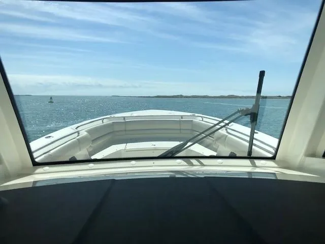 Slide: The Image of 2017 Boston Whaler 330 Outrage boat view from cockpit, open sea ahead. - 8