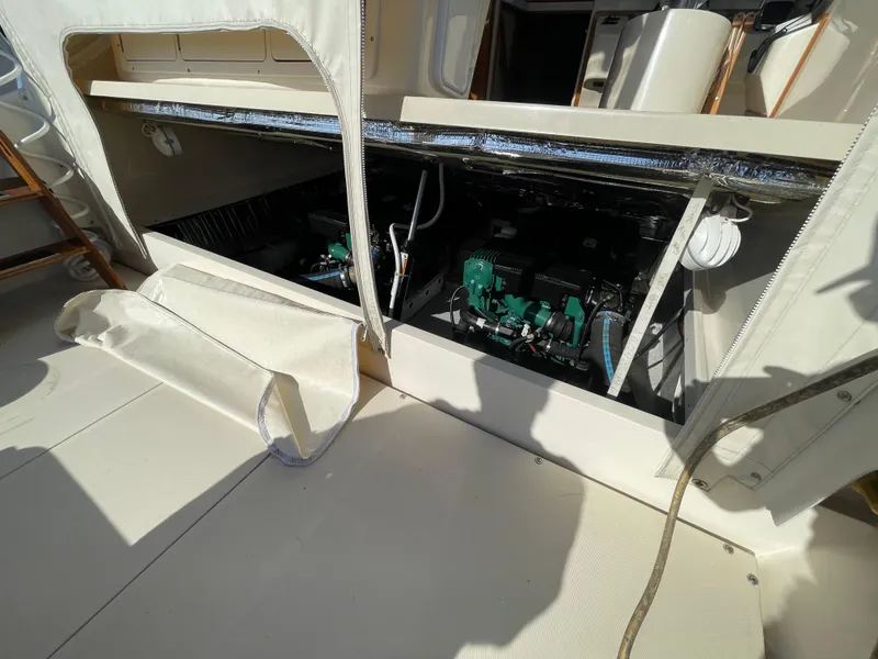 Slide: The Image of Engine compartment of a 2015 Fortier 30 boat, showcasing dual engines. - 25