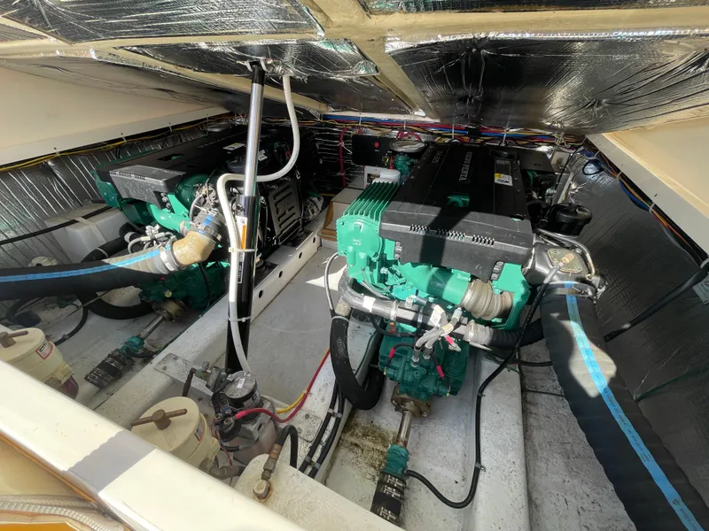 Slide: The Image of Engine room of a 2015 Fortier 30 boat with dual green engines. - 26