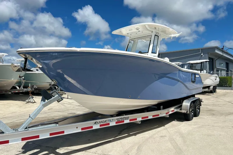 The Image of 2026 Sea Fox 268 Commander boat on trailer under blue sky. - 1