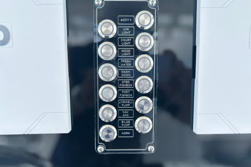 Slide: The Image of Control panel of 2026 Sea Fox 268 Commander boat with labeled buttons. - 11