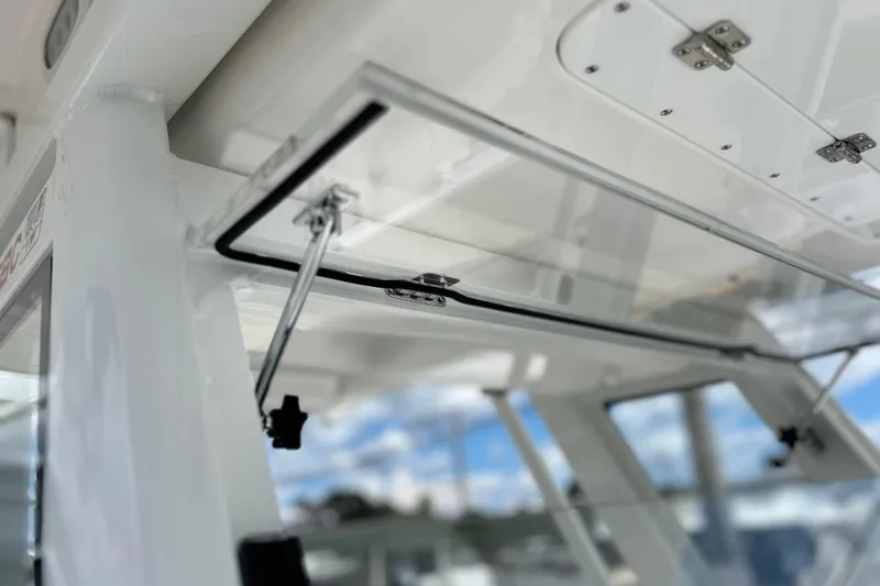 Slide: The Image of 2026 Sea Fox 268 Commander boat interior with open hatch and clear sky view. - 13