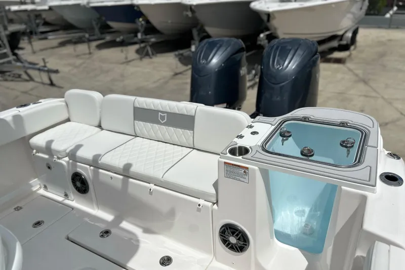 Slide: The Image of 2026 Sea Fox 268 Commander boat interior with seating and dual engines. - 16