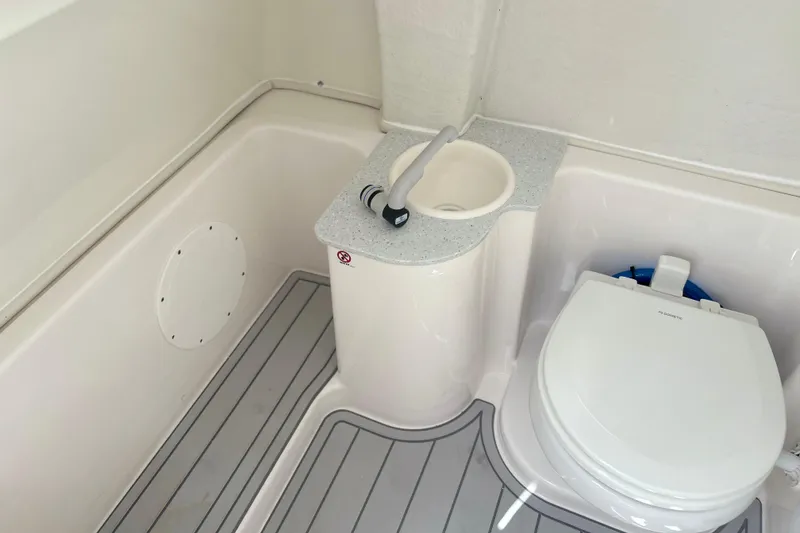 Slide: The Image of 2026 Sea Fox 268 Commander boat bathroom with sink and toilet. - 22
